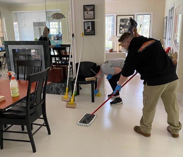 Hard at work! Sweeping.